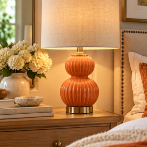 JONATHAN Y Daphne 20 inch orange ribbed gourd table lamp with a white linen drum shade.